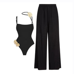 Black Elegance Floral Accent Swimsuit with Ruched Fringe Skirt
